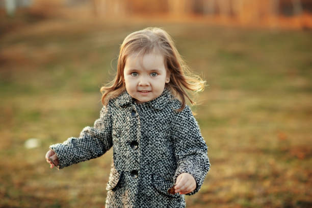 istock Cute little girl outdoors in coat. 681921986