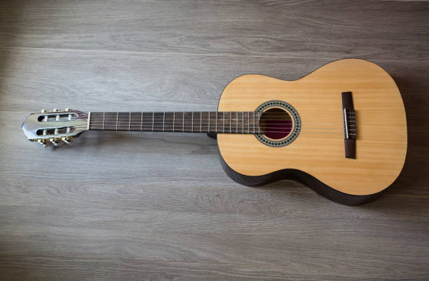istock Guitar on wooden background, fretboard 681922284