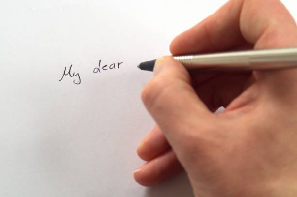 istock Hand writing My dear... in handwriting on white paper 681932046