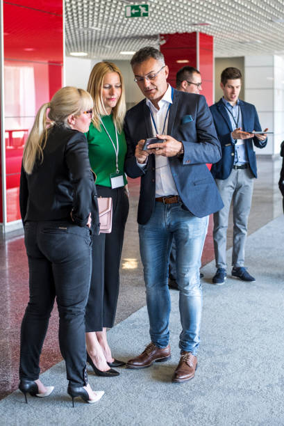 istock Business people talking in the office building lobby 681936164