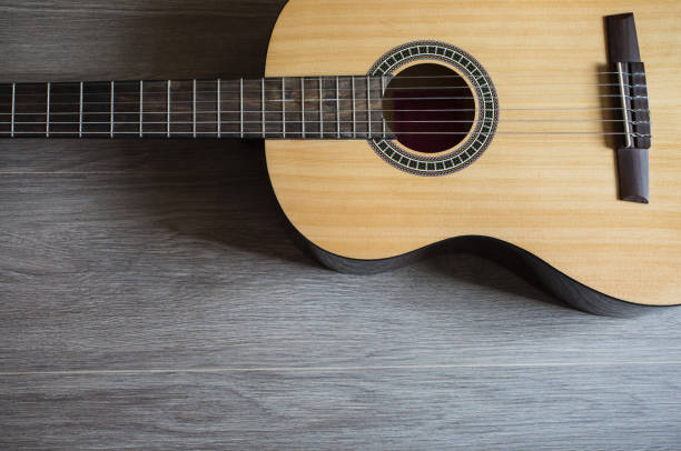 istock Guitar on wooden background, fretboard 681939160