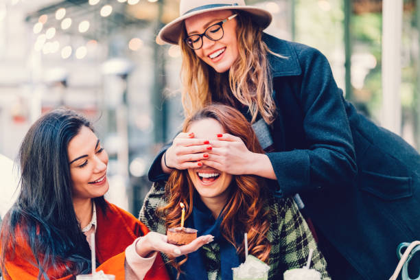 istock Women surprising their friend with birthday cake 681939162