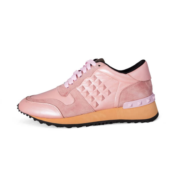 istock female sneaker isolated on white background 681939472