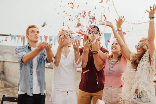 istock Friends throwing confetti in the air 681940150