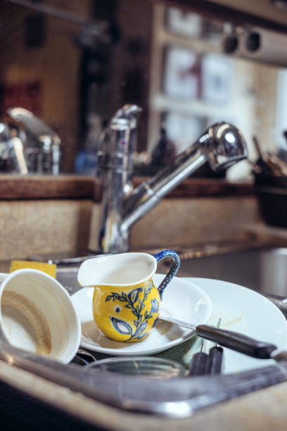 istock Dishes in the sink 681942392