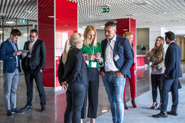 Business people chatting in office building lobby