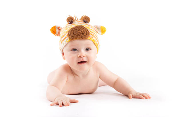istock cutie little boy in white diaper and deer hat 681946218