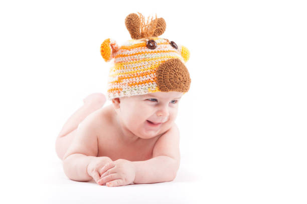 istock beauty little boy in white diaper and deer hat 681947000