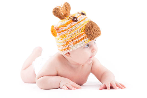 istock beauty little boy in white diaper and deer hat 681947004
