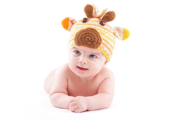 istock beauty little boy in white diaper and deer hat 681947026