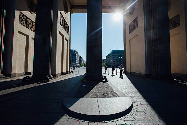 istock People Walking Amidst Brandenburg Gate Columns In City 681949087