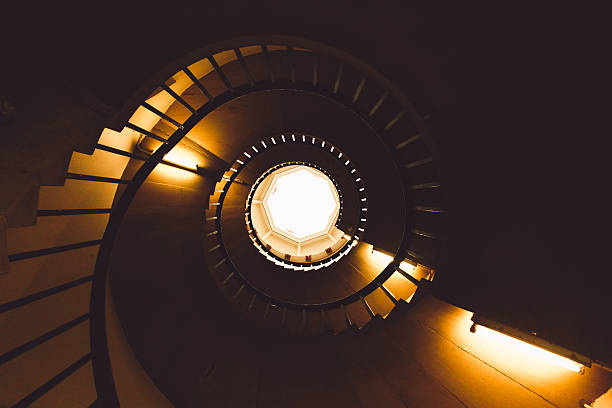istock Directly Below Shot Of Spiral Staircase In Building 681950949
