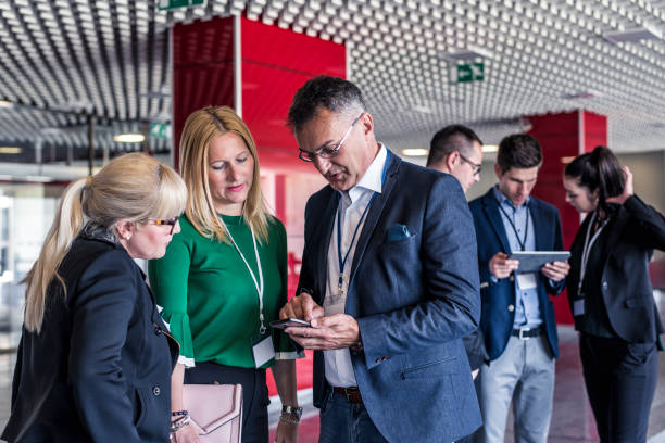 istock Colleagues chatting in business center lobby 681951992