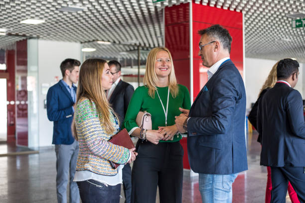 istock Smiling business people chatting in the lobby 681953320