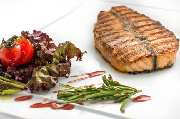 istock Grilled salmon fillet isolated on white. 681962260