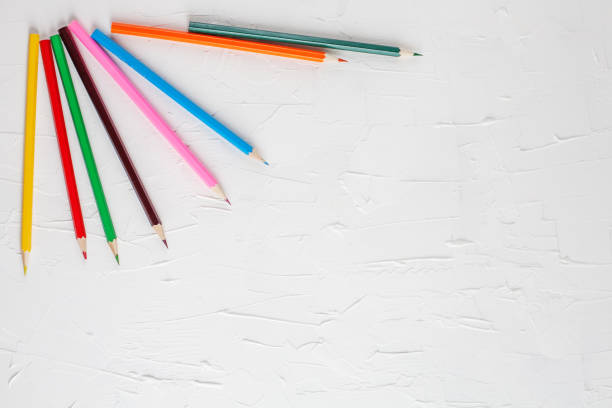 istock Colored pencils on white background. Place for inscription. The concept of study and creativity. 681975018