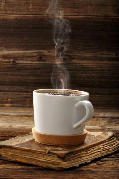 istock Old book and cup of coffee 681979730