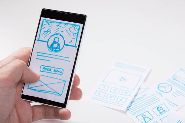 istock Smartphone with designer sketch of mobile application screen 681986852