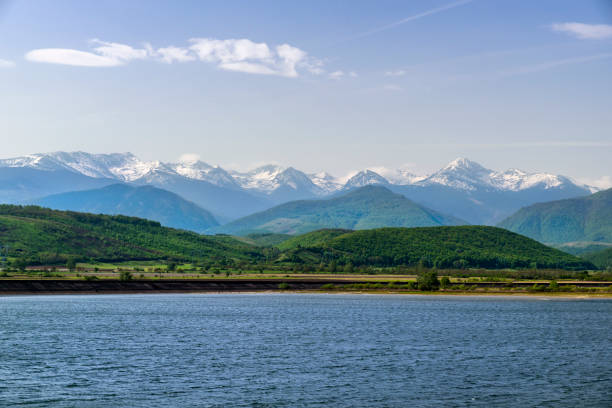 istock High mountains and dam lake 681987430