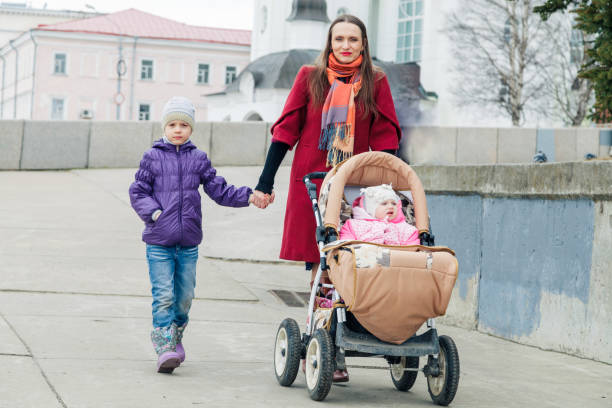 istock Happy mother walks with two daughters 681993956