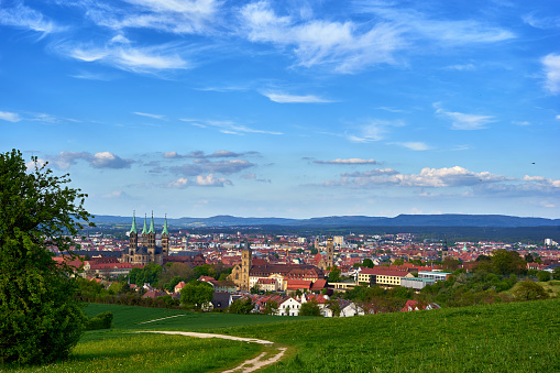 The cityscape of Bamberg in Spring/ Summer with blue sky and some clouds.
