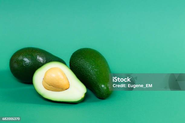 Avocado Ripened Color Fully Ripened Avocado On A Green Background Stock Photo - Download ...