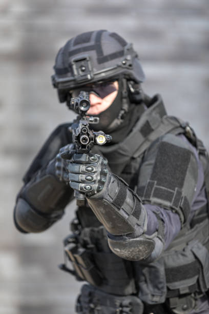 istock SWAT Police Officer Against Brick Wall 682021044