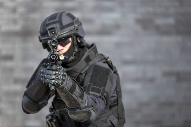 istock SWAT Police Officer Against Brick Wall 682021074
