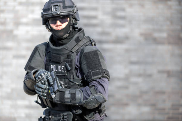istock SWAT Police Officer Against Brick Wall 682021100