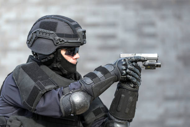 istock SWAT Police Officer Against Brick Wall 682021130