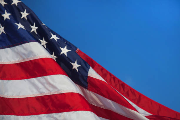 istock USA flag. American flag. American flag blowing wind. 682027842