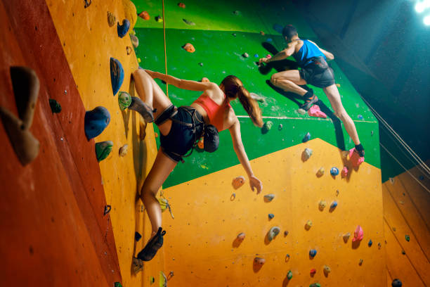 istock Two climbers purposeful climbs up the indoor climbing wall 682032046