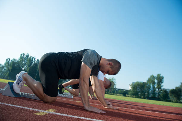 istock Runners preparing for race at starting blocks 682032282