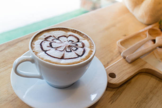 istock hot coffee with foam milk art in afternoon break. 682032408