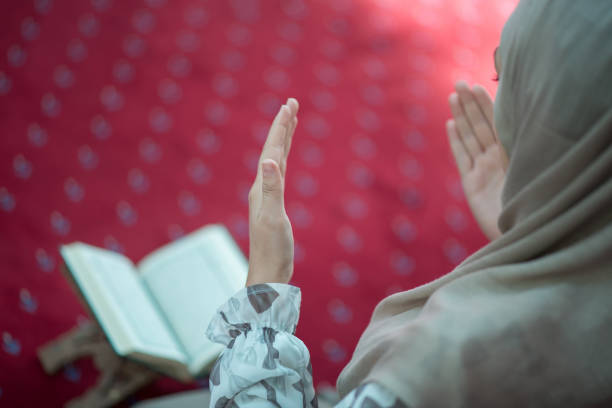istock muslim woman praying in mosque 682033008