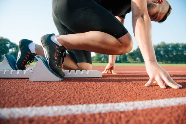 istock Runners preparing for race at starting blocks 682035138
