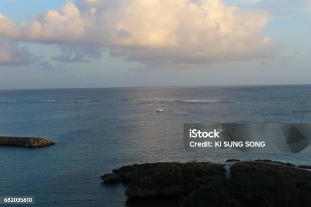 Blue Sky And Sea A Boat Is Sailing Awat From A Offshore Dock And Breakwater In The Ocean Miyako Island Okinawa Japan Stock Photo - Download Image Now