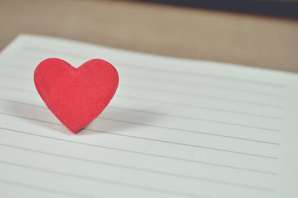istock Red heart on white paper for background 682047674