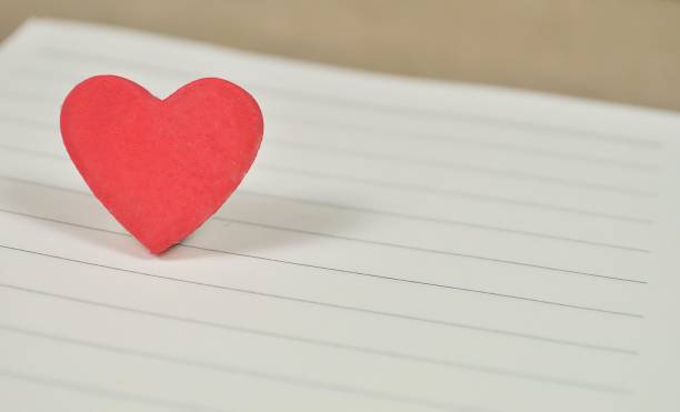 istock Red heart on white paper for background 682049792