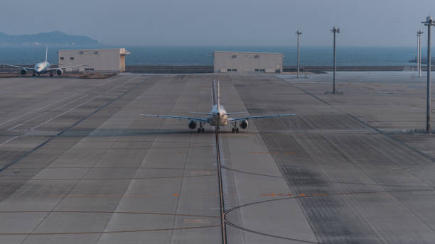 istock Jet airplane running to a runway for departure 682053766
