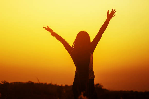 istock Woman raised hands up on the sky 682067026