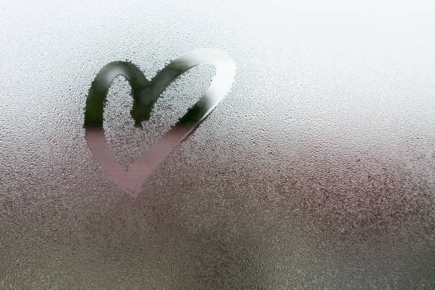 Drawn the heart shape Drawn the heart shape on vapor at the glass breath vapor stock pictures, royalty-free photos & images