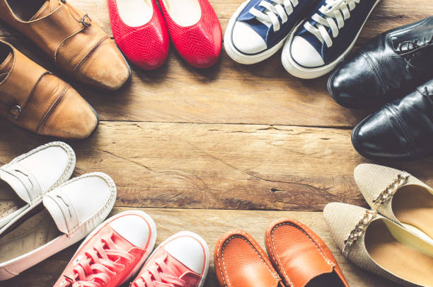 istock shoes various styles on a wooden floor - lifestyles. 682078140