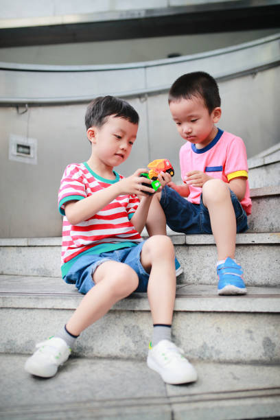 istock Cute Asian children and toy car 682080648