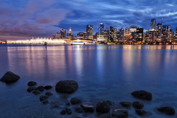 Vancouver skyline at night, Canada Vancouver skyline at night in Stanley park at long exposure. shadow british columbia landscape cloudscape stock pictures, royalty-free photos & images