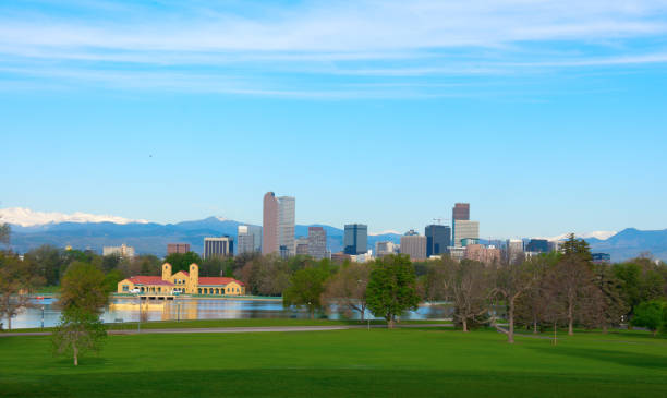 istock Downtown Denver panoramic skyline buildings with snowcapped mountains and trees 682085566
