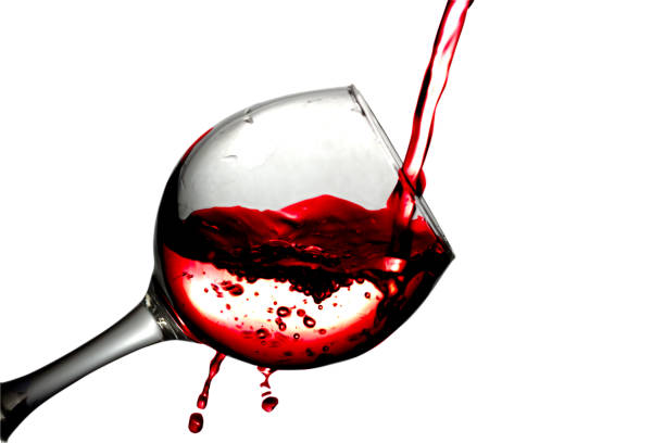 istock Red desert wine poured in glass on white background 682100280