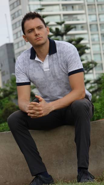 istock Man Sitting In Urban Park 682104548