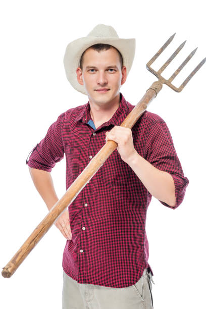 istock Vertical portrait of a farmer on a white background with a pitchfork 682107968