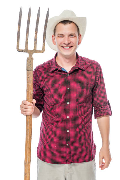 istock Smiling farmer in hat with pitchfork on white background in studio 682107996